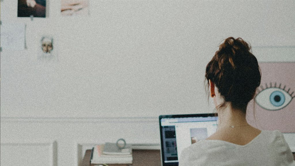 A woman working at her desk on her laptop